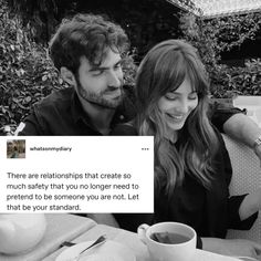 a man and woman sitting at a table with tea cups in front of them on twitter