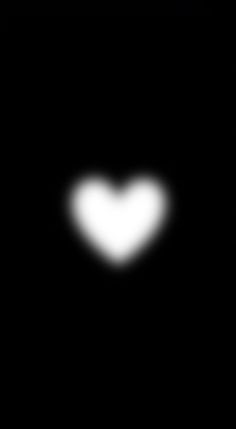 a heart shaped object is seen in the night sky with only one light visible on it