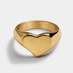 Amore Gold Heart Ring for Women - Ideal Girlfriend Birthday Present, Bridesmaid Gift, Teen Valentine's Present Wear your heart on your finger and add a little warmth to your everyday look with the Amore Gold Heart Ring. This classic ring is a great staple accessory, featuring smooth edges and a perfectly leveled heart. The Amore Ring is finished with a polished exterior and a brushed interior, available in extensive sizing and two colors. Each ring comes protected by a soft velvet jewelry pouch, Luxury Polished Finish Heart Ring Gift, Birthday Presents For Girlfriend, Measure Ring Size, Teenager Gifts, Gold Heart Ring, Present Perfect, Girlfriend Birthday, Smooth Edges, Valentines Gifts For Her