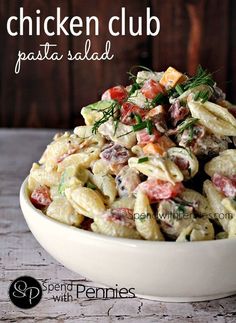 a bowl filled with pasta salad on top of a table