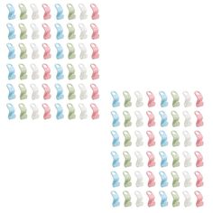 two rows of pastel colored plastic figures with white and pink ones in the middle