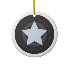 a black and white star ornament hanging from a string