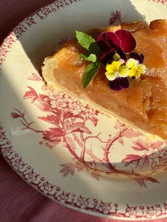 a piece of pie on a plate with flowers