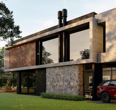 a red car is parked in front of a modern house with stone and wood exterior