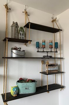 some shelves with candles and other items on them