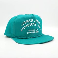 Vintage James Jacks Co Snapback Trucker Hat Color: Teal Green Size: One Size Fits All - Unworn - Vintage 90s - Snapback - Printed Logo - Adjustable - Cotton Canvas - Advertising, Industrial - Made In Bangladesh Condition: Unworn. Sku: Ac-934 Vintage Blue Adjustable Trucker Hat, Vintage Blue Snapback Hat With Flat Bill, Vintage Blue Trucker Hat With Flat Bill, Vintage Green Baseball Cap With Flat Brim, Vintage Cotton Snapback Hat For Summer, Vintage Blue Snapback Hat, Vintage Green Adjustable Snapback Hat, Green Vintage Adjustable Snapback Hat, Vintage Adjustable Snapback Hat For Summer