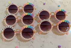 six pairs of sunglasses that say peace, love, and pom - poms