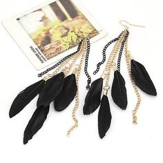 Light weight and trendy. Black feathers on gold and black chain-links. Coordinate these earrings with a boho inspired outfit. Order today and enjoy fast shipping. Bohemian Black Feather Earrings, Black Tassel Earrings For Party, Black Feathered Jewelry For Party, Black Feather Jewelry For Party, Bohemian Black Chain Jewelry, Black Chain Dangle Earrings, Black Dangle Earrings With Chain, Elegant Black Feather Jewelry, Black Bohemian Tassel Earrings For Party