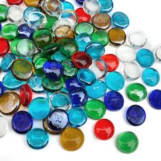 a pile of colorful glass marbles laying on top of each other