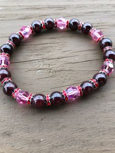 Perfect for Valentines Day is this beautiful stretch bracelet made with Natural Garnet gemstones and Pink Swarovski Crystals.  Handmade with love!! Red Beaded Stretch Bracelet For Valentine's Day, Valentine's Day Beaded Crystal Bracelet, Elegant Red Crystal Bracelet For Valentine's Day, Valentine's Day Heart-shaped Stretch Bracelet With Heart Beads, Heart-shaped Crystal Bracelets For Valentine's Day, Mother Daughter Bracelets, Blue Dangle Earrings, Beach Earrings, Pink Swarovski