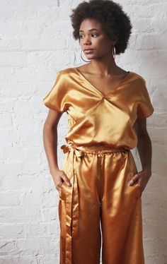 S/M Feel the vibes this summer in my Gold Satin Jumpsuit. This gold satin jumpsuit features a wrap finished top, pants with deep pockets, elastic waist and tie finish. Gold Jumpsuits And Rompers For Summer Night Out, Chic Gold Jumpsuits And Rompers For Night Out, Gold Chic Jumpsuit For Night Out, Chic Gold Jumpsuit For Night Out, Womens Jumpsuits, Satin Jumpsuit, Jumpsuit Elegant, Gold Satin, Pants Suit