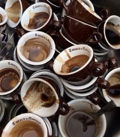 coffee cups filled with different types of chocolate saucer on top of each other in a bowl