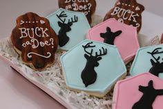 decorated cookies in the shape of deer and buck's head with words on them