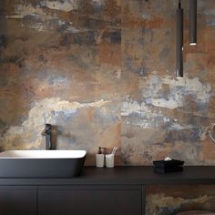 a bathroom with two sinks and a large mirror on the wall next to each other