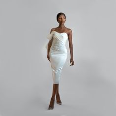 This Lovely draped off-the-shoulder dress comes with a sweetheart neckline, pleated panel at chest going down to the waist, then joined by beautiful hand beaded embroidery around the waist area. The White details on this piece are a combination of Pearls and sequins fixed by hand to perfection. With a Midi penciled silhouette, you’ve got room to show off your pretty shoes. Pair this dress with a single strap high heeled sandals and you are good to go. Dry Cleaning Only Dress With Pearls Detail, White Dress Midi, Midi White Dress, Dress With Pearls, Hand Beaded Embroidery, Dress Drape, Pearl Dress, Statement Dress, White Midi Dress