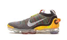 The Nike Air VaporMax 2020 Flyknit presents a colorway with the perfect balance of multi-colored brightness and a neutral shade of grey. In the "Iron Grey/Multicolor" colorway, the high-performance lifestyle sneaker boasts a grey base interspersed with a multi-colored pattern across most of the Flyknit upper. A recycled yarn weave is intertwined beneath at the toe and midfoot area, giving the grey almost a purple-toned hue. What makes the shoe pop is the green, orange, and yellow marbled heel co Multicolor Shoes, Athletic Shoes Nike, Jordan Retro 1, Nike Air Jordan Retro, Air Jordan Retro, Stadium Goods, Recycled Yarn, Grey Sneakers