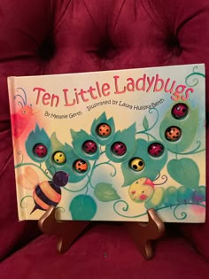 a children's book about ten little ladybugs sitting on a red chair