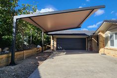 a house with a large carport in front of it