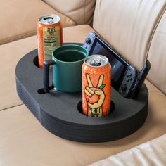 two beer cans sitting on top of a tray