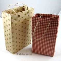 two paper bags with stars on them are sitting side by side in front of each other