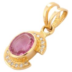 Pink Sapphire Pendant in 18K Gold with Diamonds. It has a oval cut sapphire studded with diamonds that completes your look with a decent touch. Pendants are used to wear or gifted to represent love and promises. It's an attractive jewelry piece that goes with every basic outfit and wedding too. PRODUCT DETAILS :- Material - 18K Solid Yellow Gold Gemstone - Pink Sapphire Stone Weight - 1.56 ct Stone Shape - Oval Stone Size - 8 x 6 mm Diamond Weight - 0.11 ct Diamond size - 0.9 mm Diamond Pcs - 14 Gross Weight - 2.305 Grams Setting - Bezel setting We can customize the Gold Gemstone Pendants according to your specification. Go to our Storefront Page for more updates and click on the follow button to never miss out on our newly added jewelry collection. All our jewelry products are stamped acc Pink Sapphire Pendant, Gemstone Pendants, Sapphire Studs, Follow Button, Sapphire Pendant, Oval Stone, Sapphire Stone, Diamond Sizes, Gold Studs