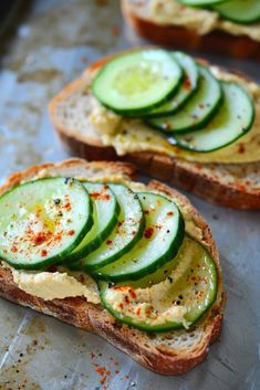 slices of bread with cucumbers on them