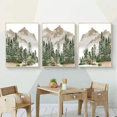 three paintings are hanging on the wall above a table and chairs in a room with white walls