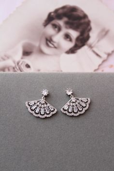 Small  vintage style  earrings   Colour: rhodium(silver tone) /clear. Measurements: approx 21 mmx20mm (small and delicate).  Materials:  rhodium over brass components, micro pave zircon crystals. Stud earrings. Great for wedding or other celebration. MORE SAME STYLE: https://www.etsy.com/uk/shop/BridalArtDeco?ref=listing-shop-header-item-count&section_id=23918122 Please note some images have been enlarged to allow for details to be shown. Read the descriptions for details on actual size of each Glamorous Sterling Silver Earrings For Wedding, Glamorous Sterling Silver Wedding Earrings, Art Deco White Gold Wedding Earrings, White Gold Art Deco Wedding Earrings, Vintage Silver Earrings For Wedding, Vintage Silver Wedding Earrings, Vintage Silver Bridal Earrings For Evening, Classic Bridal Earrings For Wedding, Art Deco Silver Dangle Bridal Earrings