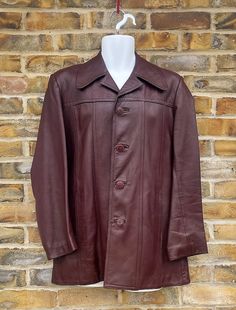 "KINGLOUIEVINTAGE   Quality Vintage & British made clothing DESCRIPTION = Vintage 1970's Unbranded superb oxblood colour and quality super soft \"Nappa\" leather jacket. Notched lapels, four button front opening and two side pockets. Single rear vent and lovely copper lining. Superb quality period garment in pretty much unworn condition BRAND = Unknown SIZE (UK) = 36 CONDITION :- = Excellent  MEASURMENTS (Inches) = ARMPIT - ARMPIT :- 18\" COLLAR - HEM :- 31\" ARMPIT - CUFF :- 16\" WAIST (Laid fl Vintage Red Leather Outerwear, Classic Burgundy Leather Outerwear, Classic Burgundy Leather Jacket With Long Sleeves, Fitted Vintage Burgundy Outerwear, Fitted Burgundy Vintage Outerwear, Retro Single Breasted Leather Jacket, Retro Single-breasted Leather Jacket, Classic Burgundy Leather Jacket, Belted Coat