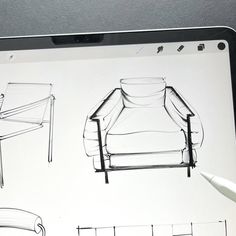 a tablet with sketches of furniture on it