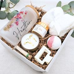 an open box with personal care items in it on a white tableclothed surface