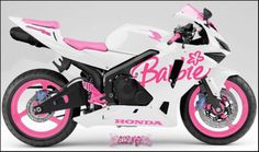 a white and pink motorcycle with the words barbie on it