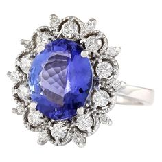 Stamped: 14K White GoldTotal Ring Weight: 8.1 GramsRing Length: N/ARing Width: N/AGemstone Weight: Total Natural Tanzanite Weight is 5.72 Carat (Measures: 12.90x10.65 mm)Color: BlueDiamond Weight: Total Natural Diamond Weight is 0.75 CaratColor: F-G, Clarity: VS2-SI1Face Measures: 21.10x19.95 mmSku: [704060W] 14k White Gold Diamond Ring, Tanzanite Diamond Ring, Blue Tanzanite, Gold Diamond Ring, White Gold Diamond Rings, Natural Tanzanite, White Gold Diamonds, Sapphire Ring, Natural Diamonds