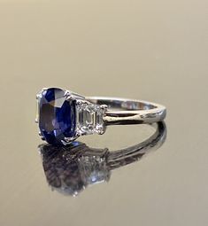 "DeKara Designs Collection Beautiful Modern/Art Deco Ceylon Blue Sapphire and Diamond Ring Metal- 90% Platinum, 10% Iridium Stones- Genuine Oval Ceylon/Sri Lanka Royal Blue Sapphire 3.75 Carats. Two Trapezoid Cut Diamonds F Color VS1 Clarity 1.09 Carats. Size-6 3/4. FREE SIZING Entirely Handmade, Classic and Timeless Art Deco Inspired Ceylon Oval Royal Blue Sapphire Diamond Engagement Ring. This ring is out of this world with the center Ceylon Sapphire being exceptional in quality, clarity, colo Blue Sapphire Engagement Ring Oval, Blue Sapphire Engagement Ring, Diamond Sapphire Engagement Ring, Ceylon Blue Sapphire, Sapphire Band, Ceylon Sapphire, Sapphire Engagement Ring Blue, Etsy Wedding Rings, Blue Sapphire Diamond