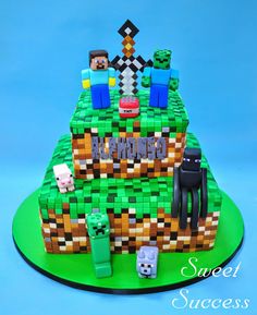 a cake made out of legos with the words minecraft on it and some animals