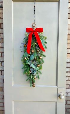 a christmas wreath hanging on the front door