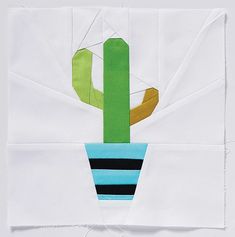 a piece of paper with a cactus in it