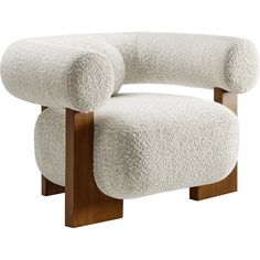 an upholstered chair with wooden legs and a white sheep - like fabric covering