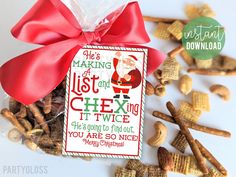 a bag of chex mix with a red bow on it and some candy in the background