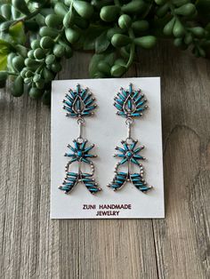 Zuni Made Turquoise Sterling Silver Dangle Earrings. It measures 2 1/2 inches long and just over 3/4 of an inch wide. Signed by artist and stamped sterling silver. Thank you for checking out my store, if you have any questions please contact me!! Exported By ExportYourStore :) SKU:448021992901_E43F* Southwestern Blue Earrings For Gift, Unique Blue Earrings Stamped 925, Blue Southwestern Style Earrings For Gift, Southwestern Blue Drop Earrings, Southwestern Style Blue Drop Earrings, Southwestern Style Blue Pierced Earrings, Southwestern Style Blue Earrings For Pierced Ears, Southwestern Blue Earrings For Pierced Ears, Turquoise Drop Earrings Stamped 925