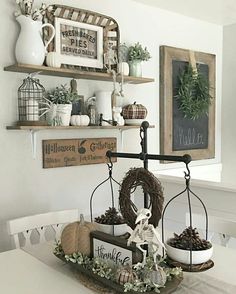 a white dining room table with some decorations on it