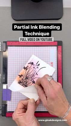 someone is cutting paper on top of a video game machine with the title partial ink blending technique full video on youtube