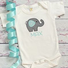 Personalized Baby Shower Gift - elephant bodysuit - elephant baby shower - personalized bodysuit - gift for baby - take home outfit Adorable little personalized elephant bodysuit makes the perfect baby gift! You will love this little elephant bodysuit! To Order: -select a size and add to cart -put name for personalization in the notes to the seller at check out. This cute baby bodysuit is the perfect little take home outfit, or even a great baby shower gift! Lettering and elephant can be done in Personalized Fitted Onesie For Gender Reveal, Personalized Fitted Short Sleeve Onesie, Personalized Fitted Short Sleeve Bodysuit, Personalized Baby Shower Gifts, Elephant Shirt, Take Home Outfit, Grey Elephant, Personalized Baby Shower, Elephant Baby Shower