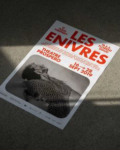 the poster for les envirres is laying on the floor