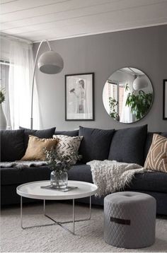 a living room filled with furniture and mirrors