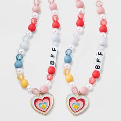 The Girls' 2pk Heart Charms BFF Necklace Set from Cat & Jack™ includes two charming necklaces with heart-shaped pendants, perfect for sharing with your best friend. With an overall length of 16 inches and a lobster claw clasp closure, these necklaces are easy to wear and secure. Made with quality zinc alloy, polyester and acrylic, these necklaces are not only stylish but also durable. Get these adorable "BFF" beads and show off your friendship in style. Cat & Jack™: Kids’ clothing with an imagin Heart Charm Necklace For Friendship, Adjustable Cute Charm Necklaces For Friendship, Cute Adjustable Charm Necklace For Friendship, Cute Adjustable Charm Necklaces For Friendship, Trendy Heart-shaped Necklace For Friendship, Playful Pink Charm Necklace For Friendship, Playful Pink Charm Necklaces For Friendship, Personalized Playful Necklace For Friendship, Valentine's Day Heart Charm Necklace For Friendship