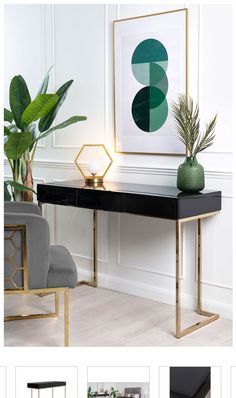 a black desk with gold legs and a green plant on it in a white room