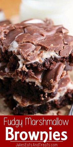 fudge marshmallow brownies stacked on top of each other