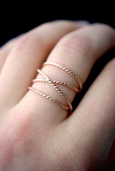 This item is made to order and will ship after 7-10 business days. That time does not include holidays, weekends or shipping time! This is a gorgeous, trend-setting ring made of twisted 14K Rose Gold-fill metal. I wrap a length of 14K Rose Gold-fill around four times and securely solder it around back. The beauty of this ring lies in its organic shape. I can never create the same wrapped effect twice, which means that every ring I make will be totally unique and individual to you. This ring will Jewelry Design Studio, Criss Cross Ring, Woven Ring, Edgy Jewelry, Art Deco Wedding Band, Twisted Metal, Gold Wrap, Man Made Diamonds, Twist Ring