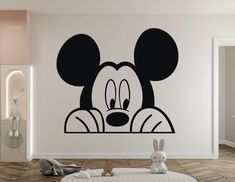 a mickey mouse wall decal in a child's room